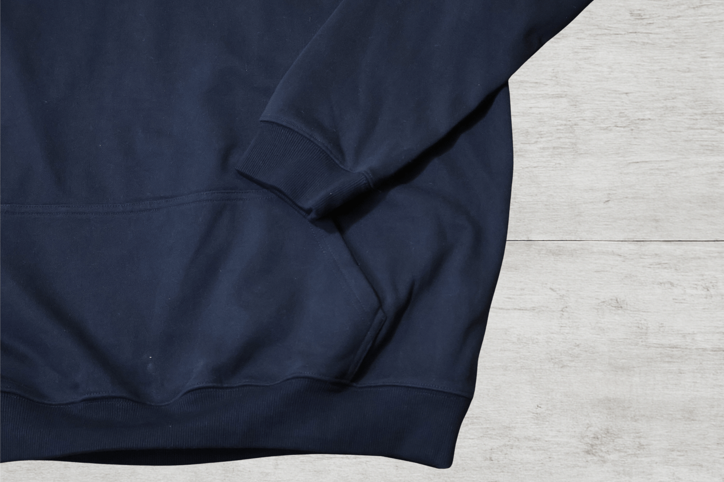 Detail of SR Black & White Premium Hoodie 450g - Unisex, showcasing plush navy fabric and cozy pocket.