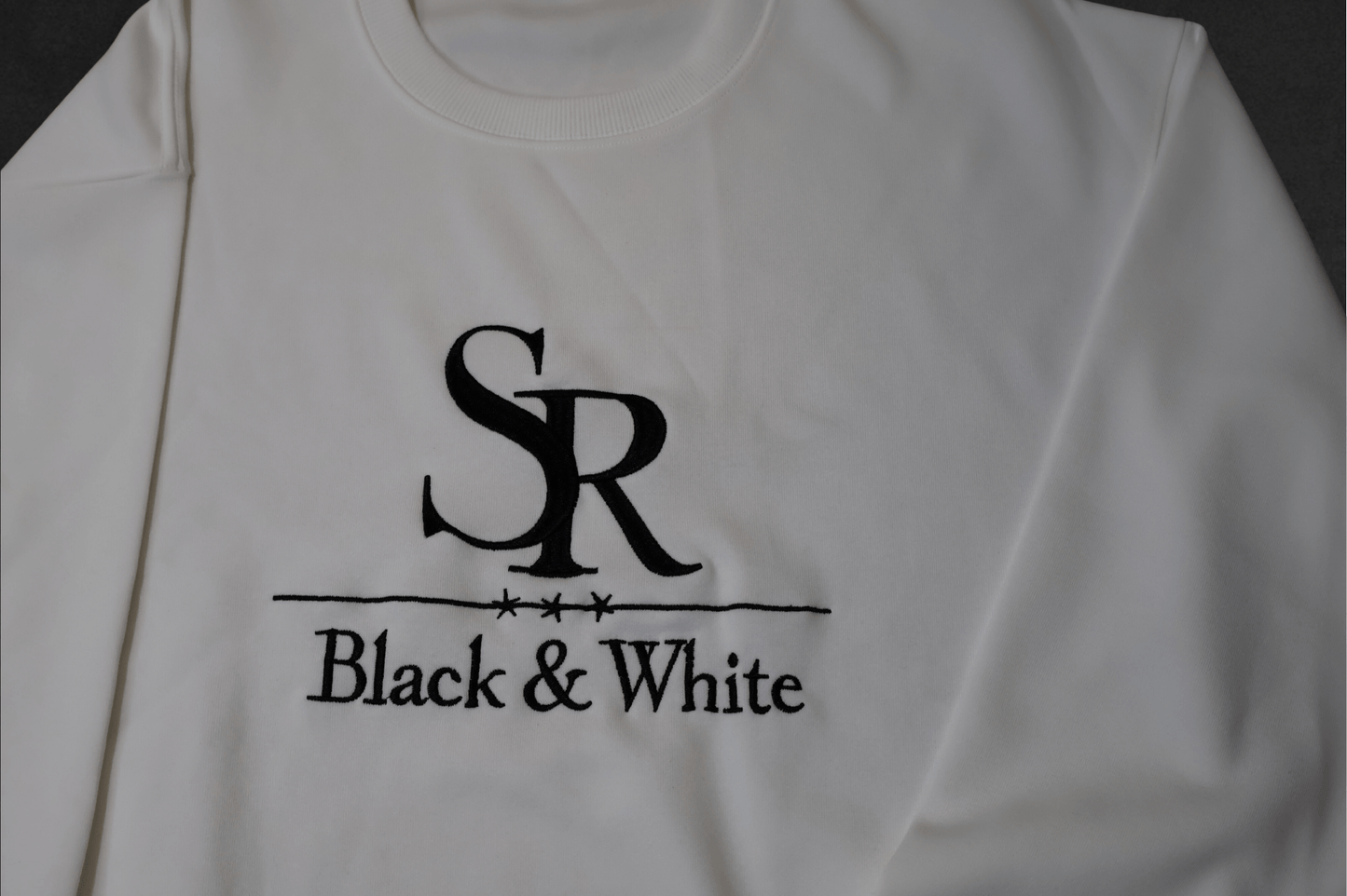 SR Black & White Sweater – Unisex, premium cotton blend, embroidered logo, minimal style, handmade fashion from Studio Romy Black and White.