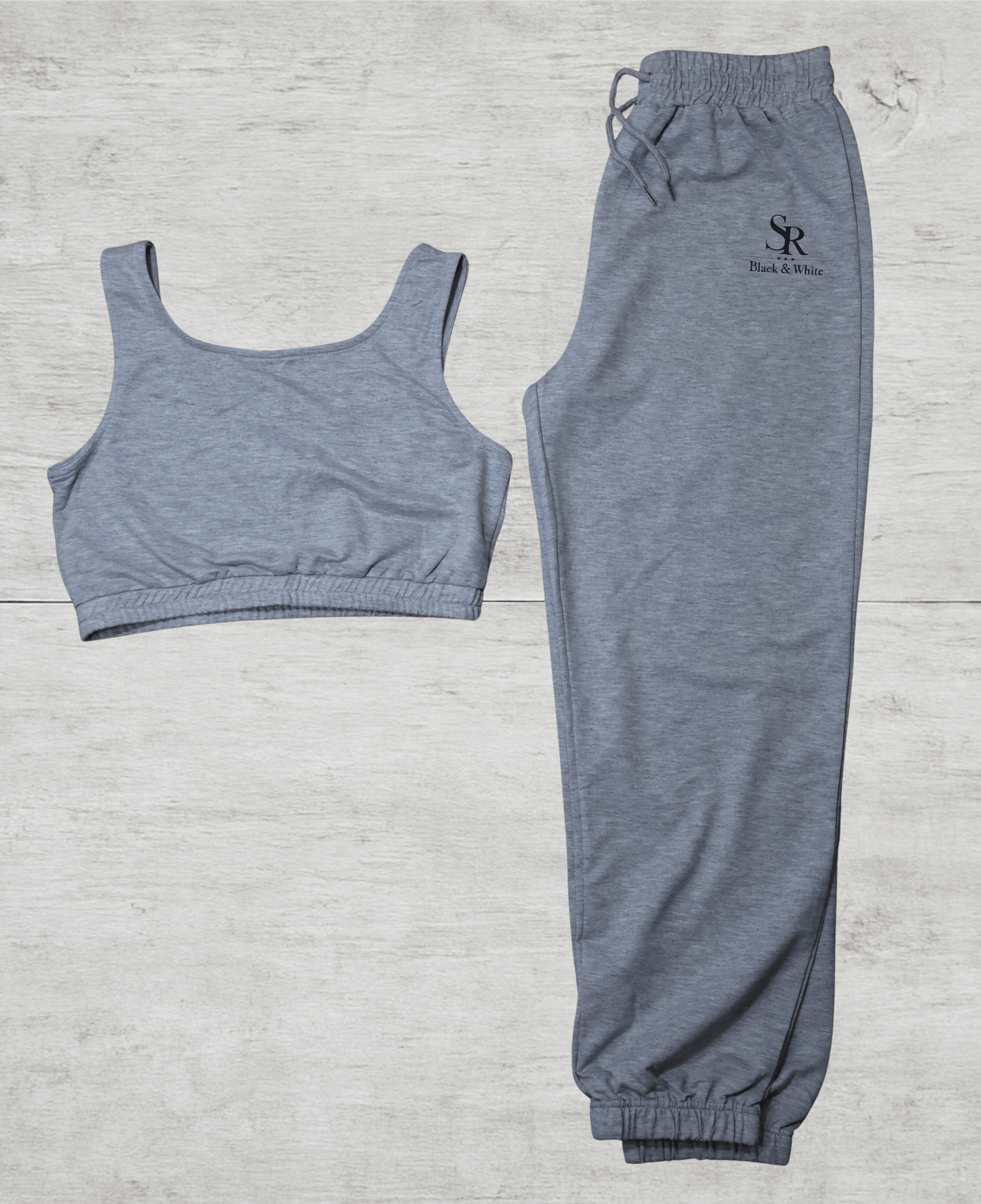 SR Black & White Women’s Basic Set – Top & Jogger in grey cotton blend, featuring logo print on top and joggers, perfect for casual wear.